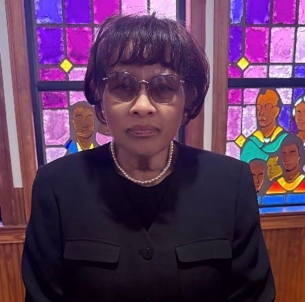 Person with sunglasses and pearls, stained glass