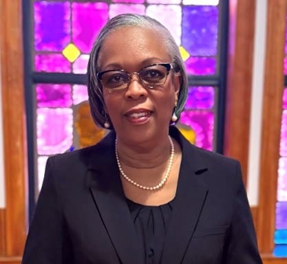 Portrait of woman with glasses and pearls