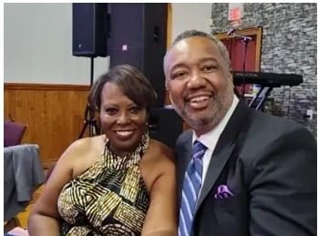 Smiling couple in formal attire at event