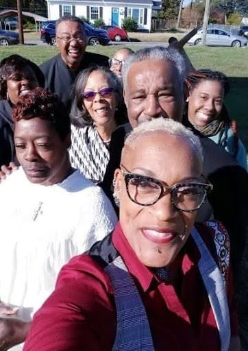 A group of people posing for a selfie